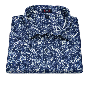 Folded blue floral pattern shirt with 'Barton' label on a white background