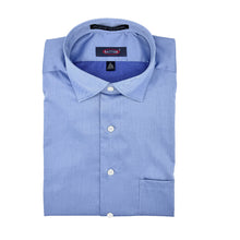 Load image into Gallery viewer, Folded light blue dress shirt with a brand label on a white background
