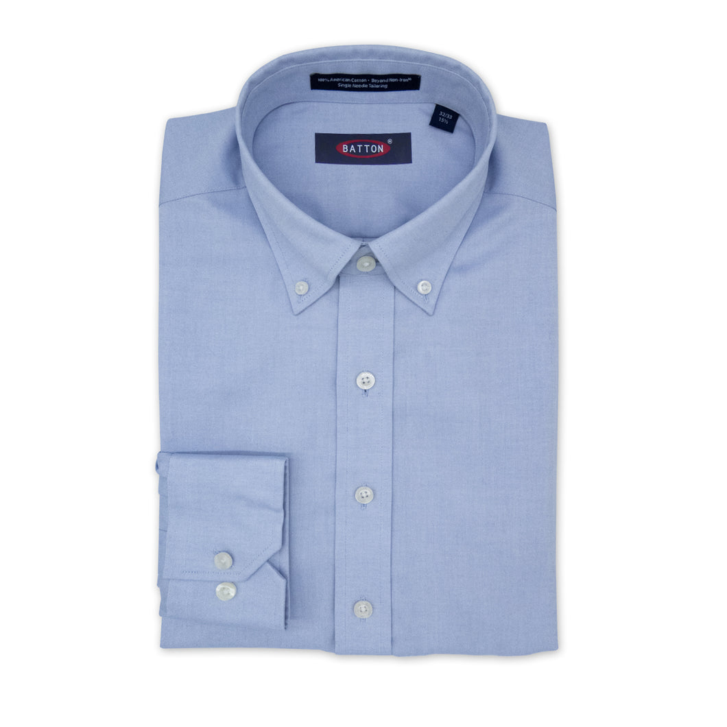 Light blue dress shirt with collar and button details on a white background