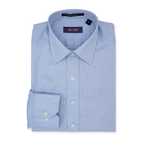 Folded light blue dress shirt with a visible brand label on a white background
