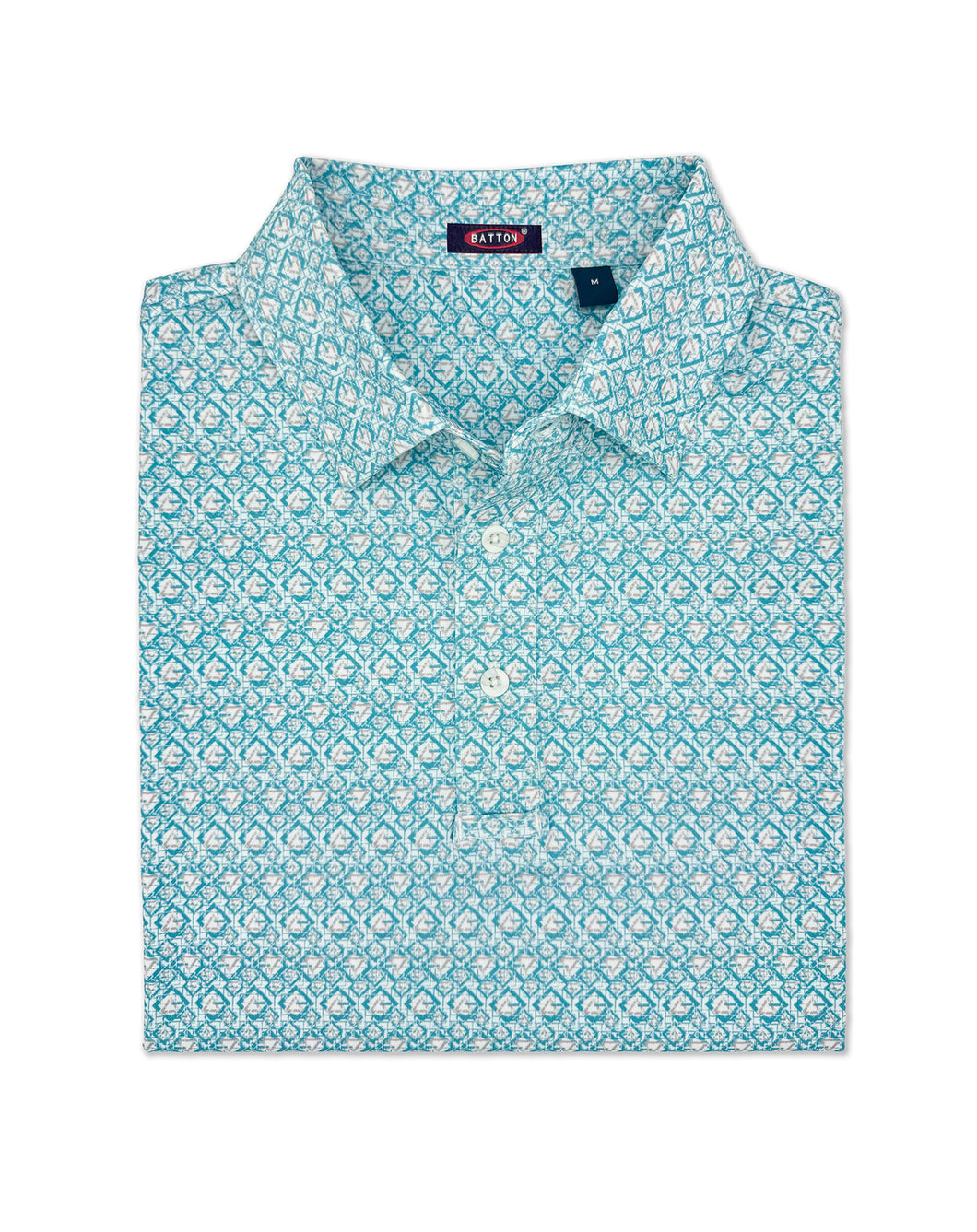 Folded blue patterned shirt with a brand label on a white background